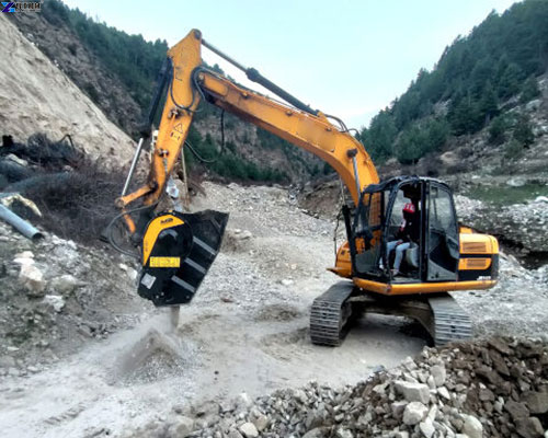 excavator rock crusher bucket work scene